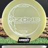Discraft Zone disc golf disc with Armory Disc Golf branding on a grass and log background